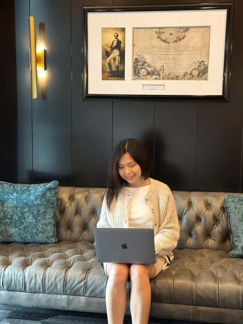 Mia Anne Reeves working on a laptop