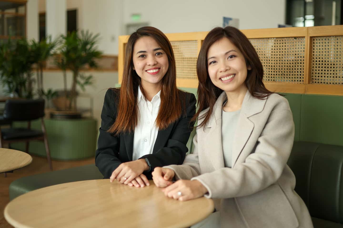 A HavenStone team member and a business owner talking through numbers at a table