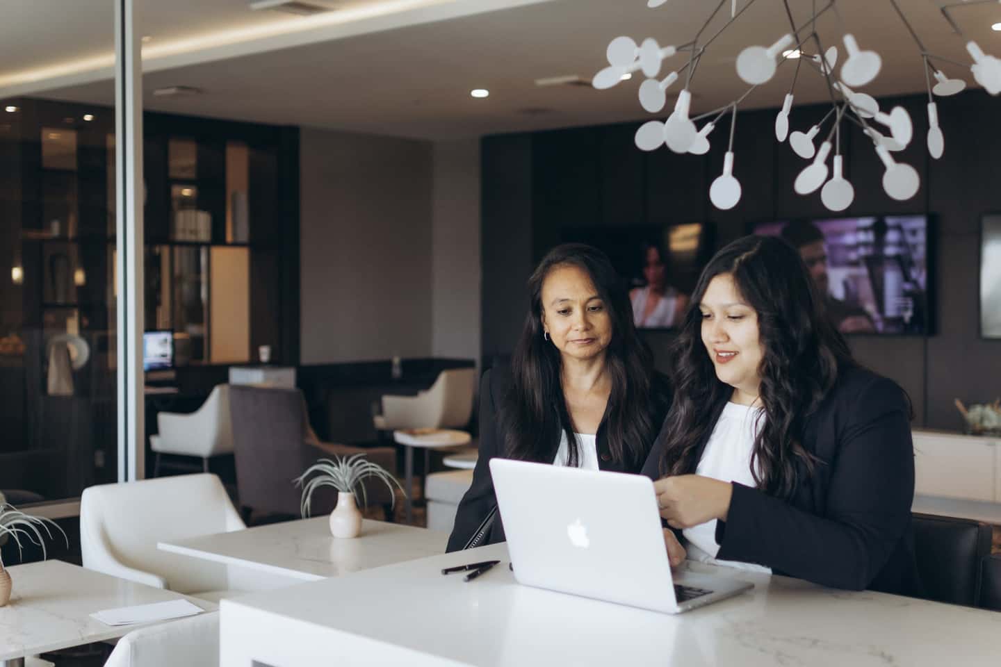 Two HavenStone accountants reviewing a client's monthly numbers together